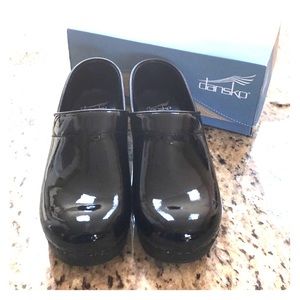 Dansko Patent Black Clogs